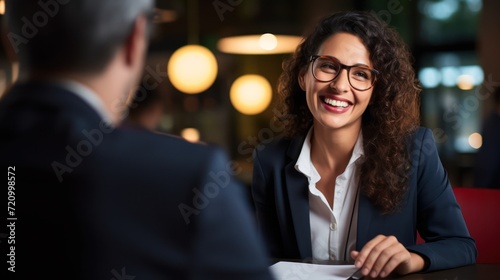 Portrait of a smiling businesswoman sitting at a table in a cafe Generative AI