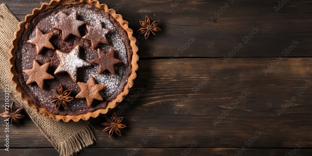 Chocolate tart with star-shaped gingerbread cookies on wooden background Generative AI