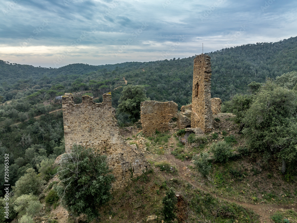 Aerial view of Castell de Vilaroma near Palamos on the Costa Brava, hilltop castle ruin with towers above the valley of St Joan de Palamos