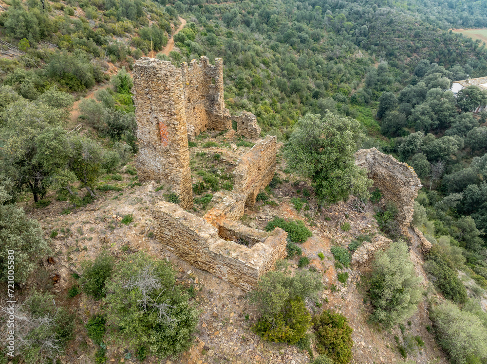 Aerial view of Castell de Vilaroma near Palamos on the Costa Brava, hilltop castle ruin with towers above the valley of St Joan de Palamos