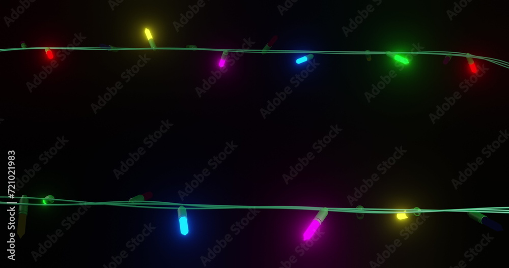 Coloured christmas string lights flashing on black background, copy space Coloured christmas string lights flashing on black background, copy space