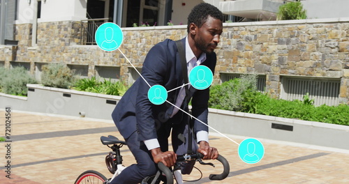 Image of connections with data processing over african american businessman with bike