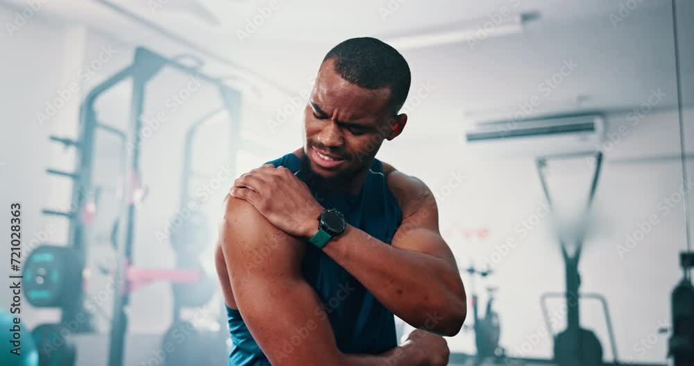 Gym, shoulder pain and black man with fitness, injury and inflammation with workout and burnout. Accident, African person and athlete with arthritis and muscle tension with exercise and fibromyalgia Gym, shoulder pain and black man with fitness, injury and inflammation with workout and burnout. Accident, African person and athlete with arthritis and muscle tension with exercise and fibromyalgia