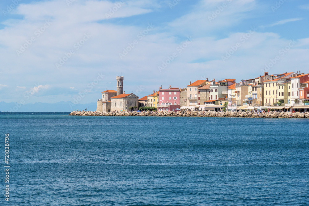 Ocean view with historic cityscape of Piran on cliff Ocean view with historic cityscape of Piran on cliff