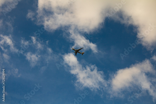 Panoramic photo of plane in blue sky