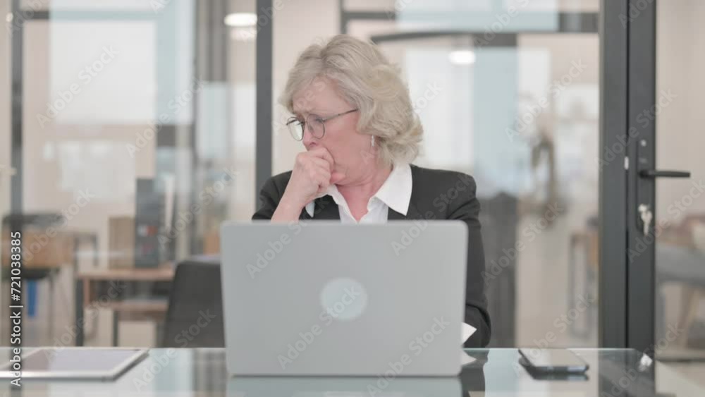 Coughing Senior Businesswoman Using Laptop Coughing Senior Businesswoman Using Laptop