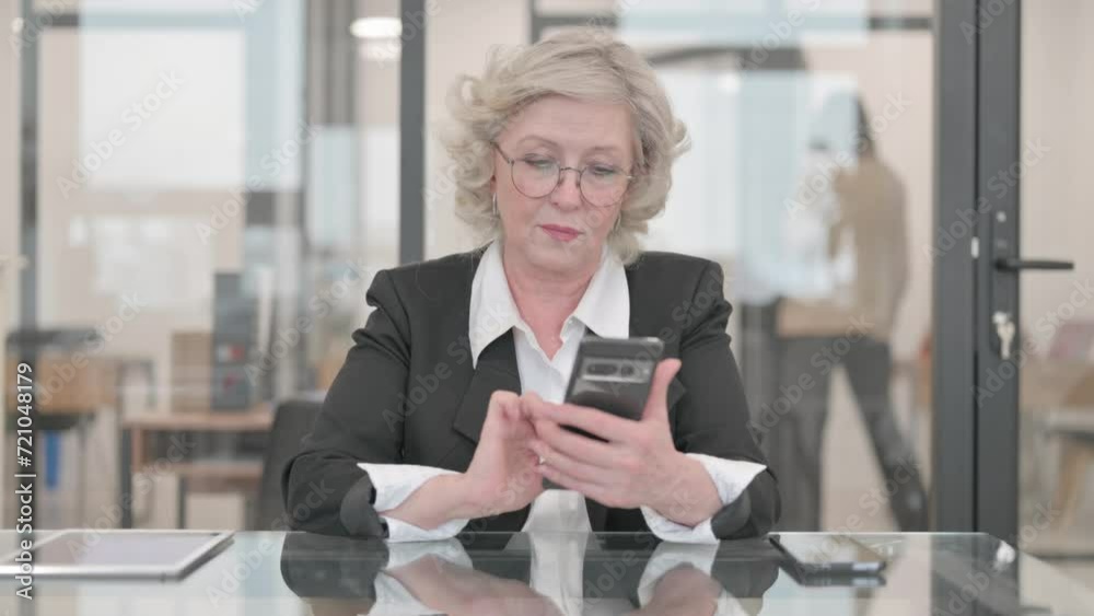 Senior Businesswoman Browsing Internet on Phone Senior Businesswoman Browsing Internet on Phone