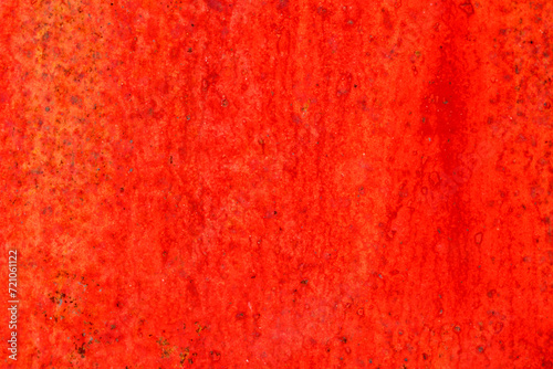 Red metal surface with spots creating textured wall background © Алексей Филатов