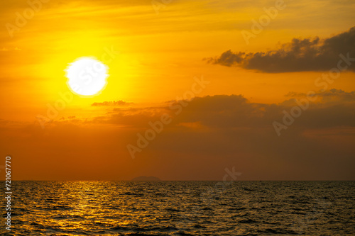 Fiery horizon  dramatic ocean sunset in vibrant hues over dark waters  nature breathtaking photo reflecting artistry of dusk s tranquil spectacle and coastal beauty