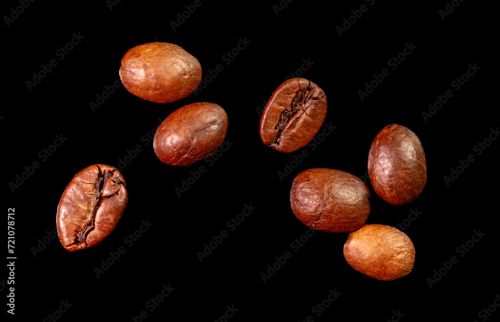 Fototapeta premium Coffee beans isolated on black background. Close-up