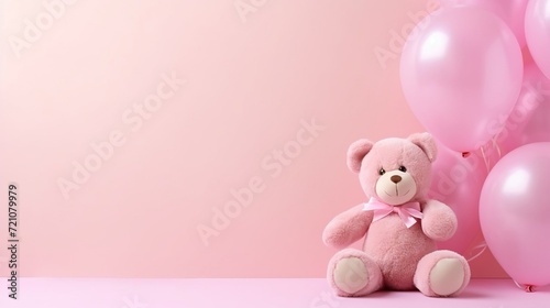 Pink balloons and a teddy bear on a pink background, a birthday and holiday concept, a birthday card for a child photo