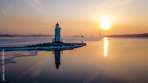 View from above. Winter Vladivostok. Tokarevsky lighthouse at dawn.