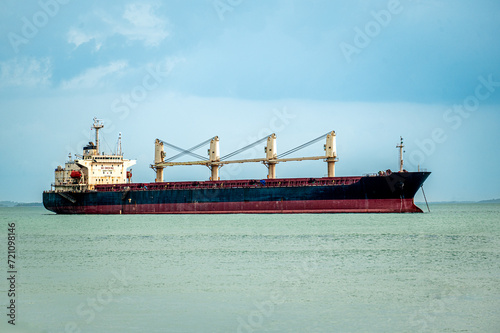 unrecognizable ship, an oil tanker sailing through Red Sea along coast of Yemen. transportation of goods important for global economy by sea photo
