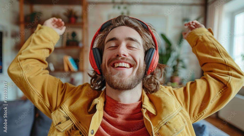 young caucasian man enjoying music in her cozy living room, wearing headphones