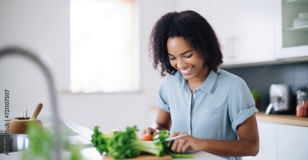 Young woman joyfully preparing a healthy salad in a modern kitchen Young woman joyfully preparing a healthy salad in a modern kitchen