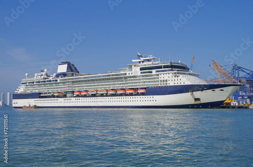 Cruiseship cruise ship liner Infinity in port with harbor infrastructure moored to pier © Tamme