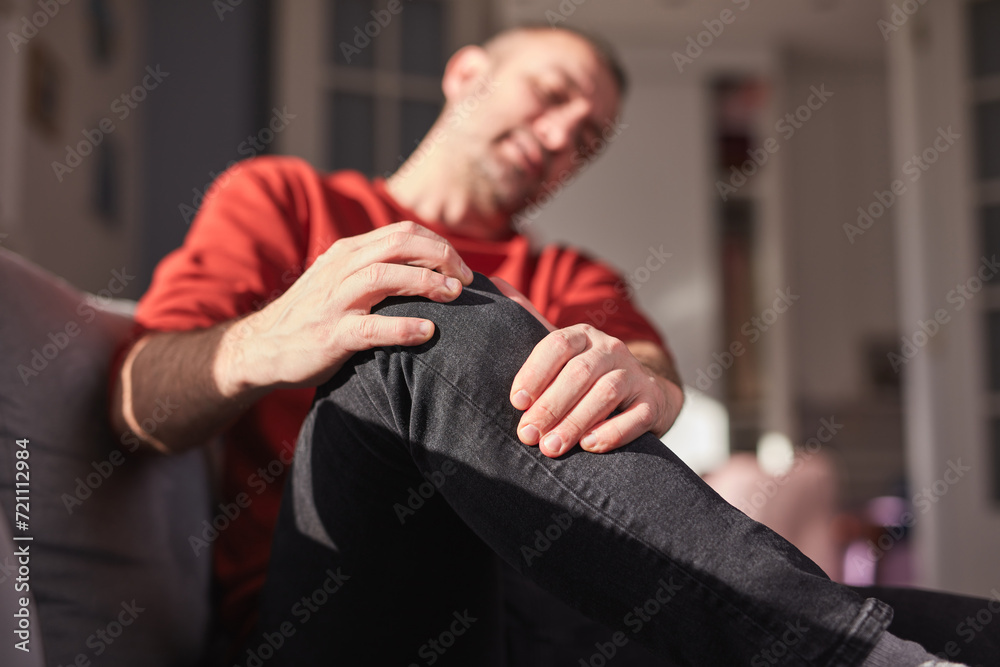 Man with knee pain at home. Man with knee pain at home.