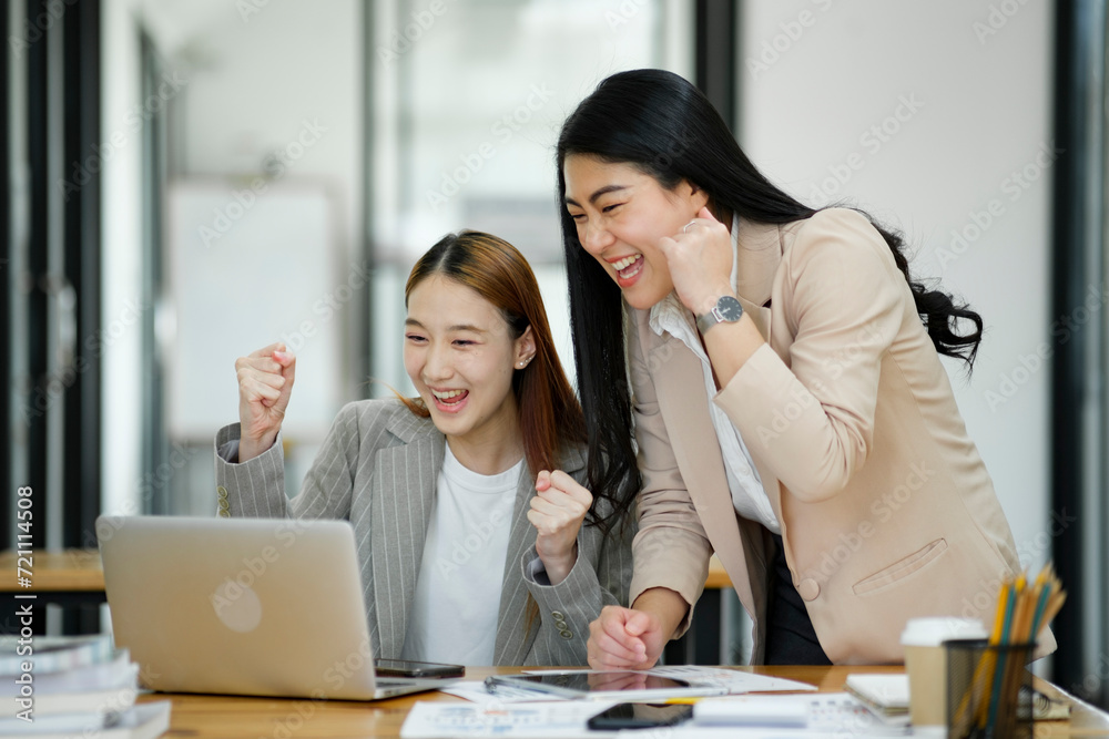 Excited Businesswomen Celebrating Success at Work. Excited Businesswomen Celebrating Success at Work.