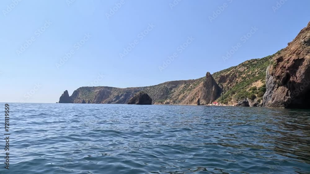 Aerial view on calm azure sea and volcanic rocky shores. Small waves on water surface. Nature summer ocean sea beach view. Nobody. Holiday, vacation and travel concept. Weather and climate change Aerial view on calm azure sea and volcanic rocky shores. Small waves on water surface. Nature summer ocean sea beach view. Nobody. Holiday, vacation and travel concept. Weather and climate change