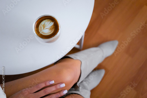 woman drinking coffee top view