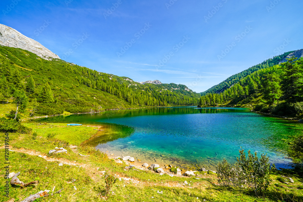 Steirersee on the high plateau of the Tauplitzalm. View of the lake at the Toten Gebirge in Styria. Idyllic landscape with mountains and a lake on the Tauplitz in Austria.
