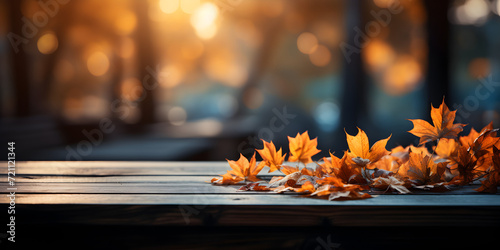 fallen leaves on wooden bench in park