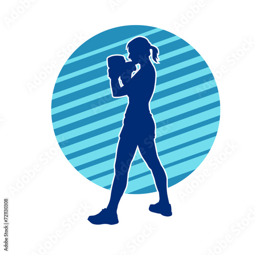Silhouette of woman boxing athlete in action pose. Silhouette of a female wearing boxing gloves for boxing sport.