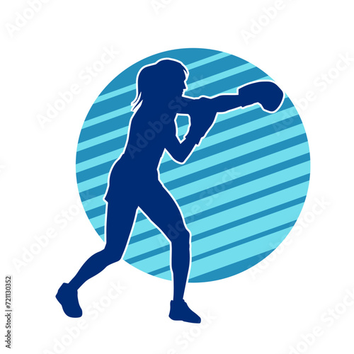 Silhouette of woman boxing athlete in action pose. Silhouette of a female wearing boxing gloves for boxing sport.