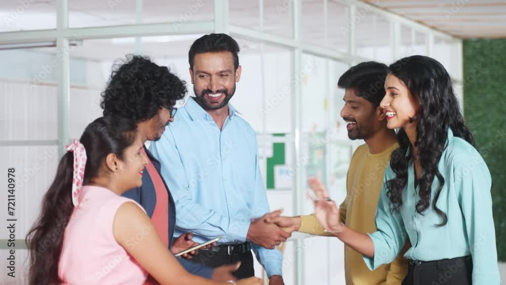 Group of employees greeting new joined team members during morning at office - concept of networking, Team collaboration and workplace cooperation Group of employees greeting new joined team members during morning at office - concept of networking, Team collaboration and workplace cooperation