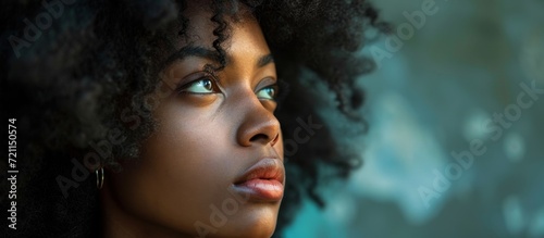 Pretty Black Woman Looking Thoughtful  A Captivating Portrait of a Pretty Black Woman Gazing Intensely and Reflecting on Life.