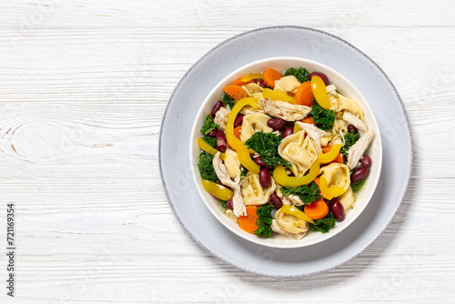 chicken minestrone soup with tortelloni in bowl