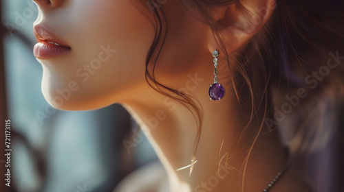 Purple gemstone earring on elegant woman's silhouette