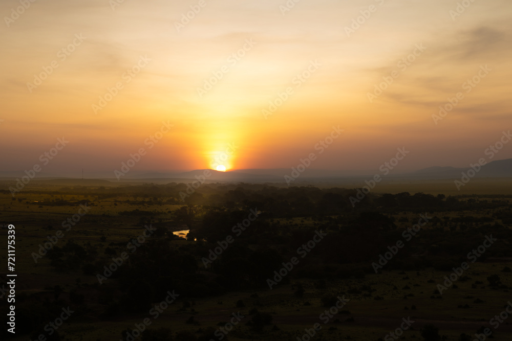 Panorama in africa at sunrise, viewed from a hot air balloon, Masai Mara National Reserve, Kenya.