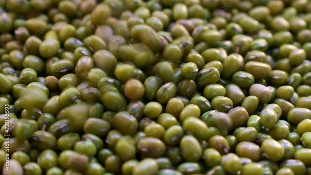 Green asian mung beans falling down close up Green asian mung beans falling down close up