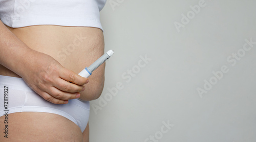 Female model showing opened Semaglutide Injection pen or insulin cartridge pen. Weight loss and diabetes concept.