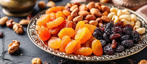 Combine dried fruits (dates, prunes, apricots, raisins) and nuts. Traditional food for Ramadan. photo