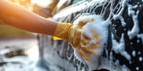 person washing car with soap foam, People cleaning car with sponge in car wash