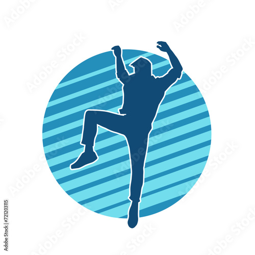 Silhouette of a slim man dancing pose. Silhouette of a male dancer in action pose.