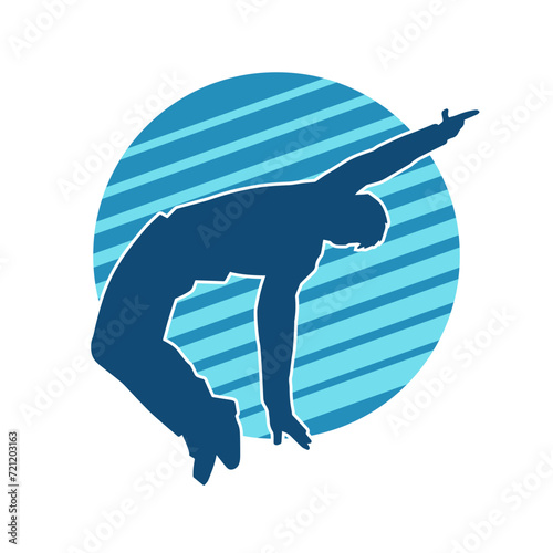 Silhouette of a slim man dancing pose. Silhouette of a male dancer in action pose.