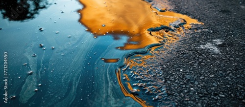 Oil spill on pavement as environmental pollution concept.