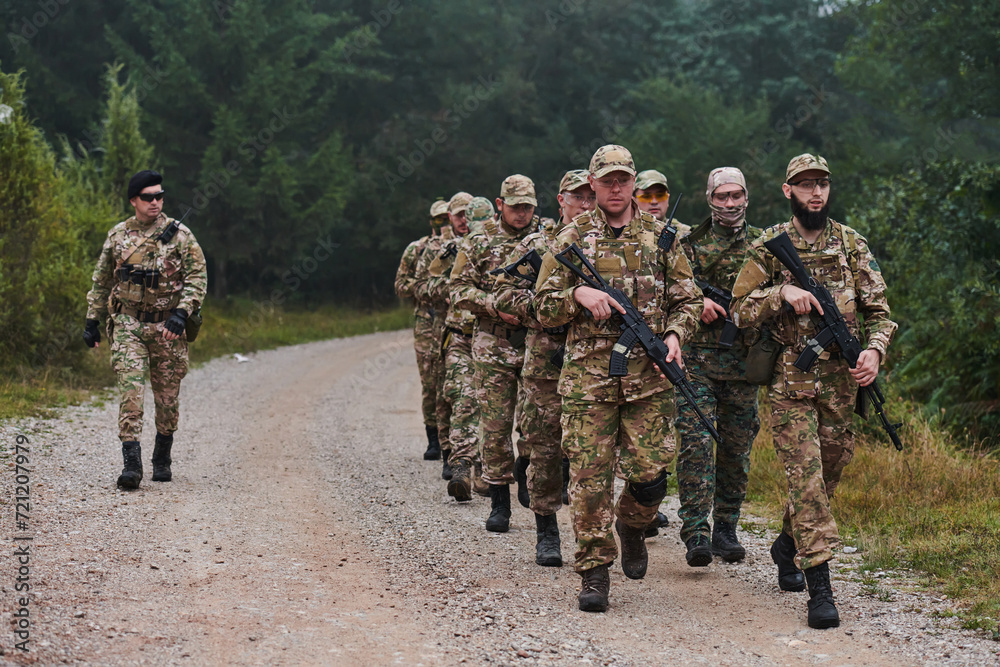 An elite military unit, led by a major, confidently parades through dense forest, showcasing precision, discipline, and readiness for high-risk operations An elite military unit, led by a major, confidently parades through dense forest, showcasing precision, discipline, and readiness for high-risk operations