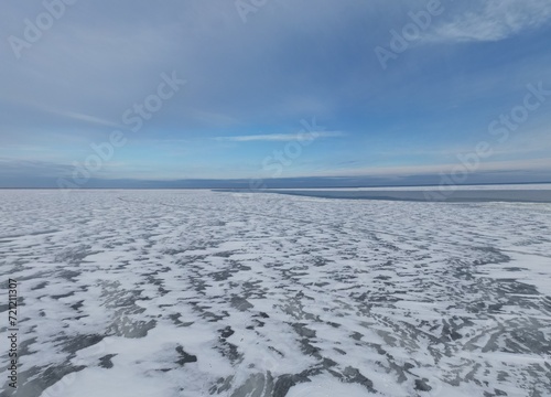 Wallpaper Mural In winter, there is a crack on the horizon on the ice-covered river. Torontodigital.ca