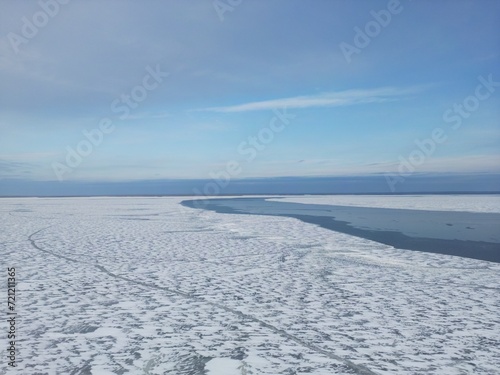 Wallpaper Mural View from above. The river is covered with ice. A crack has formed on the surface of the water. Torontodigital.ca