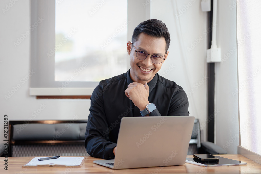 Happy middle aged business man ceo wearing suit standing in office using digital tablet. Smiling mature businessman professional executive manager looking away thinking working on tech device. Happy middle aged business man ceo wearing suit standing in office using digital tablet. Smiling mature businessman professional executive manager looking away thinking working on tech device.