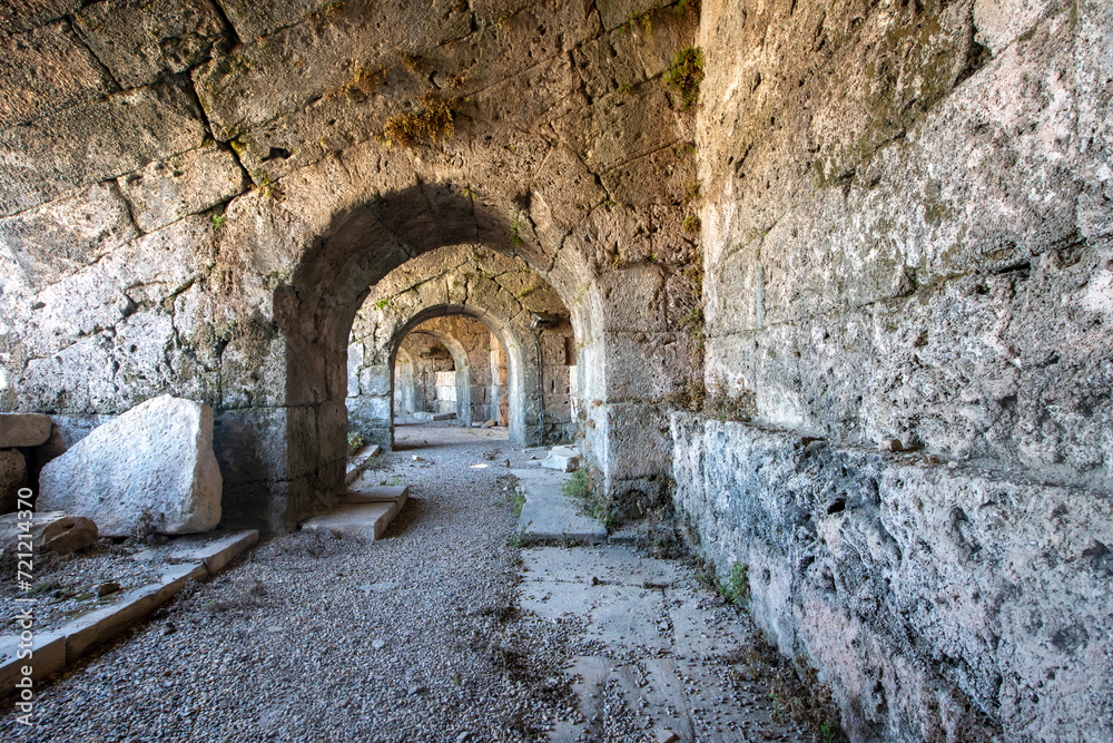 Fototapeta premium Ancient city walls. Remnants of castle walls and towers of varying degrees of destruction. Statues. Turkey. Manavgat. In Antalya. Alanya. Places to Visit Side. stone wall pieces