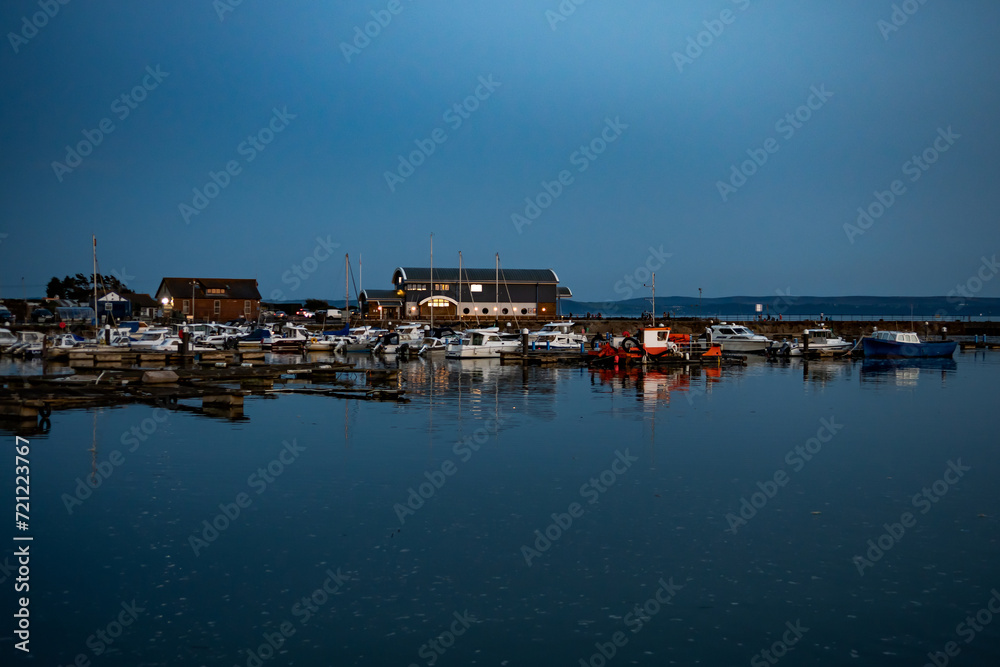 Harbor With Motor Boats In The Night In The Village Of Burry Port In Wales, United Kingdom