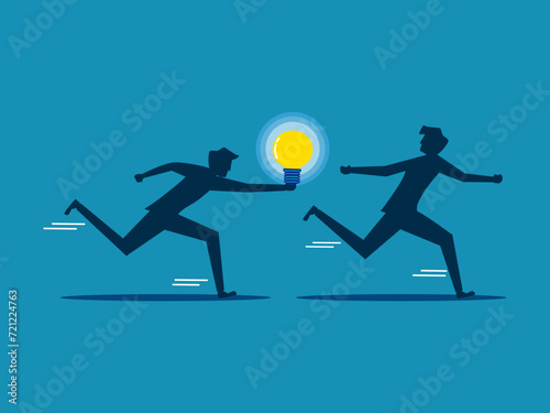 Businessman passes light bulb to running colleague