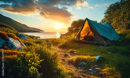 Solitary Tent on a Lush Green Meadow by the Seaside at Sunset, Offering a Peaceful and Scenic Escape into Nature's Serenity and Camping Adventure