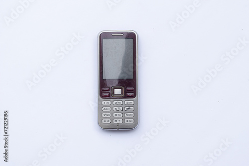 Old cell phone on white background, vintage cell phone