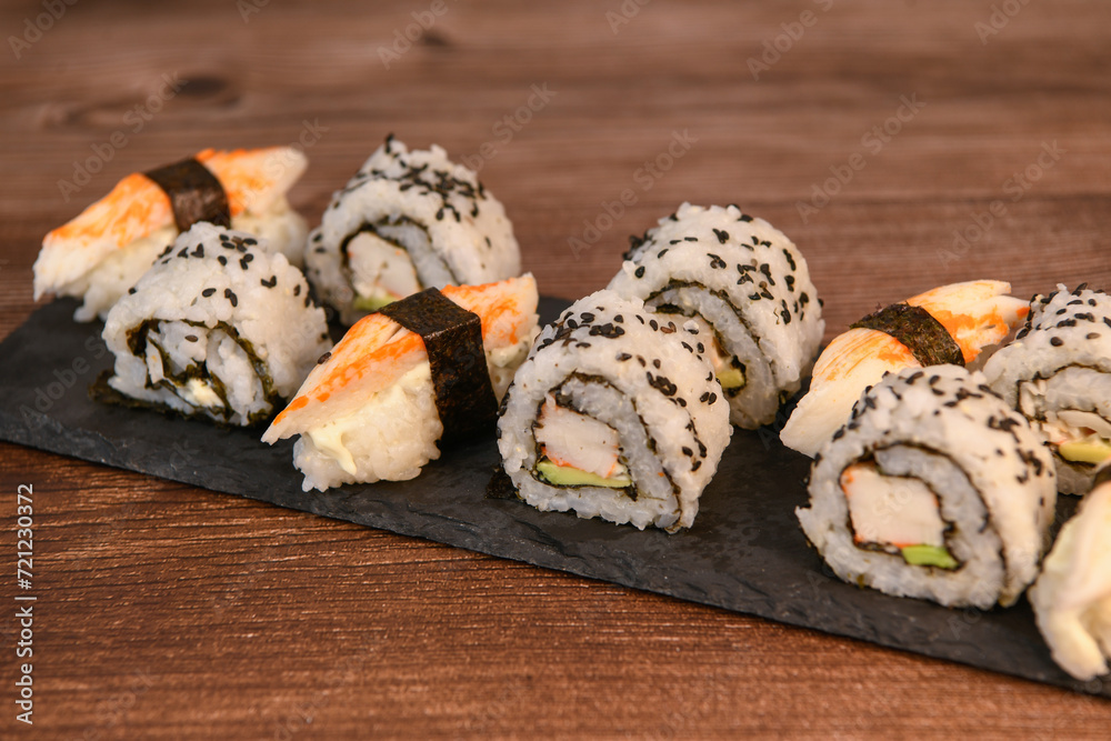 japanese sushi food. Maki ands rolls with tuna, salmon, shrimp, crab and avocado, High quality photo